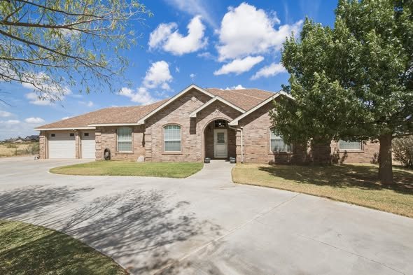 Brick home with circular driveway